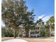 Beautiful two-story home with a large yard, mature trees, and inviting balconies at 2784 Hidden Oak Dr, Seabrook Island, SC 29455