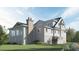 Elegant home with a large screened porch, brick chimney, and beautiful landscaping at 2784 Hidden Oak Dr, Seabrook Island, SC 29455