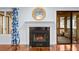 Close-up of the fireplace featuring a decorative mirror and sliding door to the balcony at 2784 Hidden Oak Dr, Seabrook Island, SC 29455