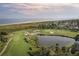 Scenic view of the golf course alongside the coastline with lush greens and manicured bunkers at 2784 Hidden Oak Dr, Seabrook Island, SC 29455