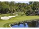 Beautiful golf course featuring a sand trap, water hazard, and lush green fairway, enhancing the natural landscape at 2784 Hidden Oak Dr, Seabrook Island, SC 29455