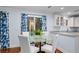 Cozy dining area near kitchen with white cabinets, granite counters, and nice view at 2784 Hidden Oak Dr, Seabrook Island, SC 29455