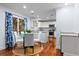 Eat-in kitchen features granite counters, white cabinets, and stainless appliances at 2784 Hidden Oak Dr, Seabrook Island, SC 29455