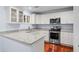 Bright kitchen features granite countertops, stainless steel appliances and white cabinets at 2784 Hidden Oak Dr, Seabrook Island, SC 29455