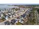 Overhead view of a waterside neighborhood with a mix of homes, landscaping, and a glimpse of the waterway beyond at 2942 Clearwater Dr, Mount Pleasant, SC 29466