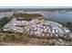 An aerial view of a residential community with waterfront views, showcasing the layout and proximity to the water at 2942 Clearwater Dr, Mount Pleasant, SC 29466