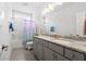 Bright bathroom featuring double sinks, granite countertops, and a combined shower and bathtub at 2942 Clearwater Dr, Mount Pleasant, SC 29466