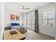 Bright bedroom featuring a ceiling fan, carpet flooring, and a door to a balcony at 2942 Clearwater Dr, Mount Pleasant, SC 29466