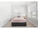Cozy bedroom featuring a comfortable bed, bright windows, and stylish decor at 2942 Clearwater Dr, Mount Pleasant, SC 29466