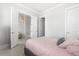 Bright bedroom with white walls, light wood floors, and a comfortable bed at 2942 Clearwater Dr, Mount Pleasant, SC 29466