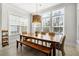 Dining room with a large wooden table and wicker chairs, perfect for Gathering gatherings at 2942 Clearwater Dr, Mount Pleasant, SC 29466