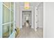 Bright entryway with light wood floors, white walls, and a view into the living room at 2942 Clearwater Dr, Mount Pleasant, SC 29466