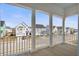 View of neighborhood from covered porch with white columns, and a well-maintained street at 2942 Clearwater Dr, Mount Pleasant, SC 29466