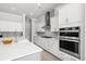 Modern kitchen equipped with stainless steel appliances, white cabinetry, and an expansive island at 2942 Clearwater Dr, Mount Pleasant, SC 29466
