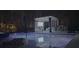 Night view of an illuminated outdoor pool and cabana with comfortable seating, creating an inviting ambiance at 2942 Clearwater Dr, Mount Pleasant, SC 29466