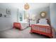 Bright bedroom with two twin beds, decorative mirrors and light fixture at 305 Pine Crest View Dr, Summerville, SC 29486