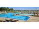 Community pool featuring beach entry, fountains, swimming area, lounge chairs and shade umbrellas at 305 Pine Crest View Dr, Summerville, SC 29486