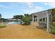 Large community pool with sun loungers, umbrellas, splash area, and lake views at 305 Pine Crest View Dr, Summerville, SC 29486