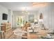 Open-concept dining room with modern decor and a dining table set for a meal at 305 Pine Crest View Dr, Summerville, SC 29486