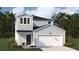 Charming two-story home with a two-car garage and manicured landscaping at 305 Pine Crest View Dr, Summerville, SC 29486