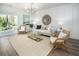Bright living room featuring modern lighting, wood floors, and access to the outdoor patio at 305 Pine Crest View Dr, Summerville, SC 29486