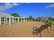 Inviting outdoor seating area featuring benches and a charming pergola for residents enjoyment at 305 Pine Crest View Dr, Summerville, SC 29486