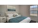 Bright bedroom with a comfortable bed, elegant lamps, and a scenic view from the window at 305 Tiliwa Street, Summerville, SC 29486
