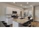 Modern kitchen featuring stainless steel appliances, granite countertops, and a kitchen island with seating at 305 Tiliwa Street, Summerville, SC 29486