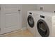 Convenient laundry room with modern appliances, including a washer and dryer at 305 Tiliwa Street, Summerville, SC 29486