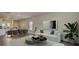 Open-concept living area with modern furnishings and an inviting view into the kitchen at 305 Tiliwa Street, Summerville, SC 29486