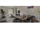 Spacious living room with modern decor, stylish dining table, and bright sliding glass doors at 305 Tiliwa Street, Summerville, SC 29486