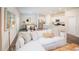 Open-concept living space featuring a comfortable white sofa, modern decor, and a view into the kitchen and dining areas at 306 Tiliwa St, Summerville, SC 29486