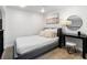 Modern bedroom with neutral tones, carpeted floors, and contemporary decor at 377 King St # 203, Charleston, SC 29401