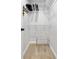 Walk in closet with carpet and wire rack shelving for ample storage space at 377 King St # 203, Charleston, SC 29401