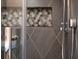 Close-up of a stylish shower featuring decorative tile accents and modern fixtures at 377 King St # 203, Charleston, SC 29401