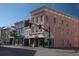 Street view of colorful buildings with retail shops in a vibrant city neighborhood at 377 King St # 203, Charleston, SC 29401