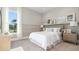 A cozy bedroom with a stylish bed, a neutral color palette, and bright natural light at 4 Preserve Rd, Johns Island, SC 29455