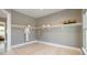 A well designed walk-in closet features shelving, hanging rods, and an adjacent bathroom at 4 Preserve Rd, Johns Island, SC 29455