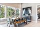 Bright dining area with large windows, a wooden table, and modern artwork on the wall at 4 Preserve Rd, Johns Island, SC 29455