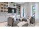 This living room has a wine rack with two chairs in front of the window at 4 Preserve Rd, Johns Island, SC 29455