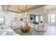 Spacious living room with light walls, open to the kitchen, modern decor, and wood-look floors at 4 Preserve Rd, Johns Island, SC 29455