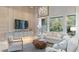Bright and airy living room featuring a decorative ceiling, light-colored furniture, and large windows at 4 Preserve Rd, Johns Island, SC 29455