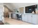 Stylish entertainment area features a built-in wet bar, custom cabinets and TV at 4 Preserve Rd, Johns Island, SC 29455