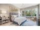 A spacious main bedroom features large windows, an area rug, and ample natural light at 4 Preserve Rd, Johns Island, SC 29455