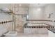 Elegant bathroom featuring a glass shower, soaking tub, and refined tile work at 40 State St # 1, Charleston, SC 29401