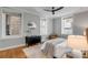 Bedroom with hardwood floors, 3 windows, dresser and closet at 40 State St # 1, Charleston, SC 29401