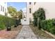Charming courtyard entrance with stone pathway and lush greenery at 40 State St # 1, Charleston, SC 29401