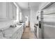 Modern kitchen with white marble counters, stainless steel appliances, and ample storage creating a chef-friendly space at 40 State St # 1, Charleston, SC 29401