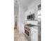 Chef-ready kitchen with stainless steel appliances, marble countertops, white cabinetry, and tiled floors at 40 State St # 1, Charleston, SC 29401