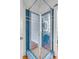 Shower stall in the bathroom with blue tile and glass door at 40 State St # 1, Charleston, SC 29401